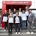 Gruppenfoto der Jubilarinnen und Jubilare mit ihren Ehrenurkunden und den Geschäftsführern Dennis Ochmann und Dirk Rutenhofer vor dem WECKBACHER Sicherheitszentrum NRW in Dortmund.